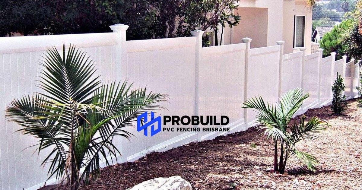 White full privacy PVC fencing with solid boards outside a house with a garden